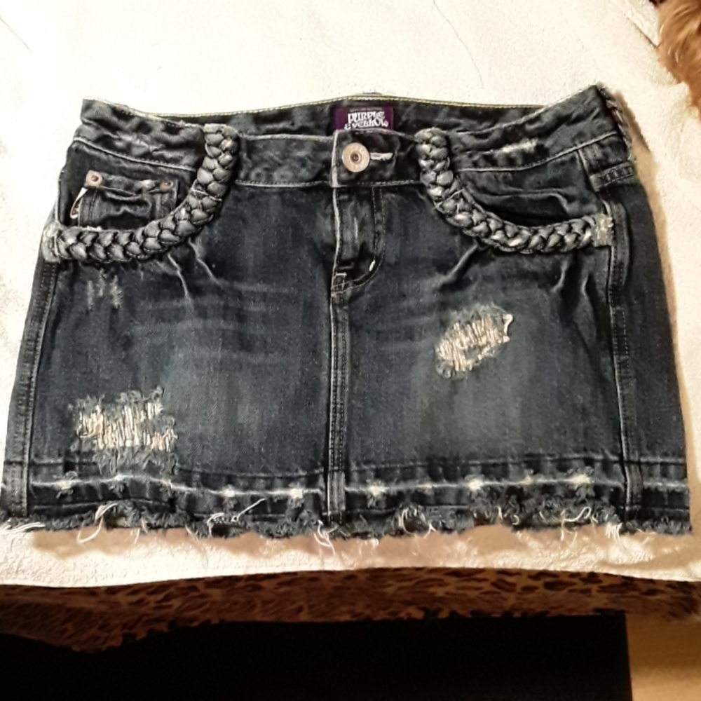 Distressed jean skirt.